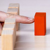 A crowd of people surrounded a red man. Accusation of crime, bandit right to a person, Lynch court. The leader in the center, the leader, an example for diving.